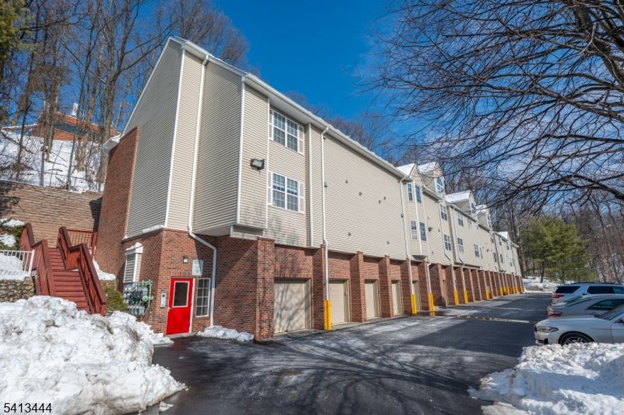 WAYNE'S BEST VALUE -- Oversized Garage Included! Welcome to this super-private one-bedroom condo in desirable Crescent Court, where only two units share a private entrance   offering rare privacy and exclusivity. Enjoy peaceful mornings or relaxing evenings on your private porch with no distractions. Located on the second floor with just one unit above, this light-filled condo features a smart, modern layout designed for comfort and functionality. The open-concept living and dining area is highlighted by a cozy wood-burning fireplace and seamless flow into the kitchen   perfect for everyday living or entertaining. Technology meets convenience with Google Home wired outlets and switches. A spacious coat closet welcomes you at entry, while the in-unit washer and dryer add everyday ease. The oversized full bathroom is beautifully updated with classic subway tile and modern finishes. The bedroom includes custom closet organizers for maximum storage efficiency. All appliances are newer and included, and the water heater is approximately 3 years old. An oversized garage --  a true premium feature   is included, providing secure parking and additional storage. Ideally located directly across from shopping, dining, and recreation. Perfect for NYC commuters with the bus stop conveniently located on Valley Road. Low HOA fee & pet friendly! Clubhouse & exercise room on site. Move-in ready and meticulously maintained --  this one checks every box.