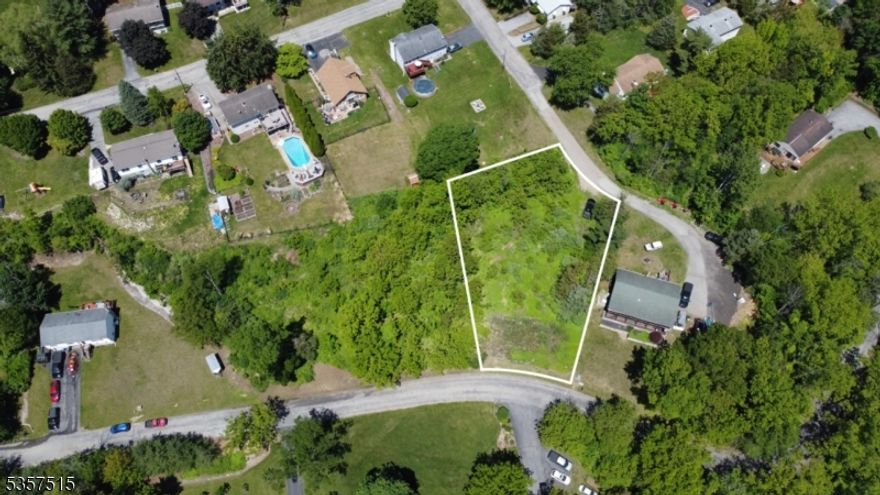 This exceptional lot, located in the highly sought-after private lake community of Vernon Valley Lake, offers breathtaking mountain views and a prime location just minutes from top-rated schools, shopping, and local amenities. Members and their guests enjoy exclusive access to a 26-acre lake ideal for swimming, boating, fishing, ice skating, and picnicking?all in a tranquil, conservation-focused setting that supports local wildlife and enhances property values. The lot includes an installed 2-bedroom septic system and is approved for a 3-bedroom upgrade, streamlining your custom build process. Detailed architectural and engineering plans are also provided, saving you time and effort. Whether you're envisioning a cozy retreat or a spacious family home, this turnkey opportunity allows you to start building without delays. With its peaceful surroundings, recreational perks, and close proximity to essential services, this is a rare chance to create your ideal living space in one of the area's most desirable communities.