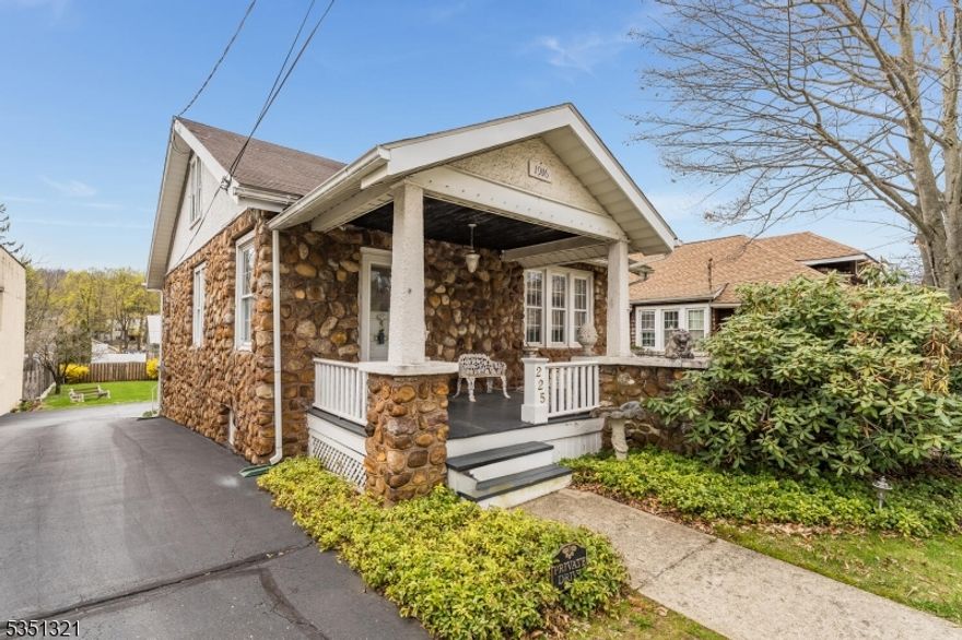 Charming 1916 stone Cape Cod. River round stone all from the Delaware River. Spacious foyer entry connects to living room/dining room combo. Primary bedroom on first level. Den or office, living room dining room combo all have wood floors.  Second floor Bedroom has Built in drawers and eve closets. Plenty off space in rear for off street parking. Full walk-out basement has connected tandem garage, Public water & sewer. Commercial possibilities.