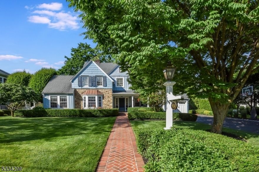 Nestled in one of Westfield's most desirable areas, this 6 Bedroom, 3.2 Bath Colonial home blends timeless charm with modern luxury and conveniences. Set on a manicured lot, this home is both a serene retreat and a commuter's dream just 5 minutes to the train station to NYC.Highlights include fine craftsmanship, elegant millwork, gleaming hardwood floors, gorgeous light fixtures, an attached 2 car garage, and thoughtful storage solutions.  Four levels unfold with spaces tailored for both grand entertaining and quiet relaxation. Step inside to a large foyer opening to a formal dining room, a bright living room with a gas fireplace, and a sunny office with a wet bar. The heart of the home is a chef's kitchen designed for gatherings, equipped high-end appliances, dual sinks, and ample custom white cabinetry. The layout flows to a breakfast area and a sunlit family room with a fireplace. Sliding glass doors open to the patio in the secluded back yard. A half bathroom, mudroom with radiant heating, and a spacious, screened-in back porch with a 3rd gas fireplace complete the main level.Upstairs, the primary bedroom is a luxurious sanctuary with enormous walk-in closets and a lavish bathroom. 3 additional bedrooms, a hall bathroom, and a fantastic laundry room complete the floor. The 3rd floor has 2 more bedrooms, a shared bathroom, and a cozy lounge space.  The finished basement offers a sprawling recreational space, a half bathroom, laundry area, and plenty of extra storage.