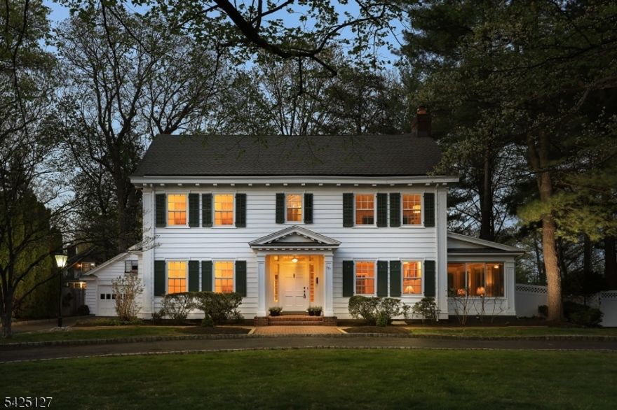 Majestically set on the iconic Boulevard, this classic Colonial welcomes you with a circular driveway & timeless curb appeal. Rich in character, the home features hardwood floors, high ceilings & elegant deep moldings throughout. The thoughtfully designed first floor offers a seamless flow between living spaces. A gracious center foyer highlighted by an elegant arched stairway leading to the second floor is flanked by a spacious formal dining room and an inviting formal living room with a fireplace. From the living room, you'll find access to both a refined office & a bright, welcoming sunroom featuring a beadboard ceiling and exposed brick wall adding warmth and distinctive charm. The kitchen is equipped with stainless steel appliances and features a charming breakfast area with bay window overlooking the fenced backyard. A powder room completes the main level. Upstairs, the second floor boasts a beautiful primary suite w/fireplace, a sunlit sitting room and a full bath. Three additional bedrooms one with a laundry closet and a full hall bath complete this level. The partially finished lower level includes a recreation room with a bar, perfect for entertaining. Outside, the fenced backyard is designed for both relaxation and enjoyment, featuring a patio, in-ground pool, and a detached two-car garage. Ideally located close to schools and just blocks from downtown shopping, dining, and NYC transportation, this exceptional home combines classic elegance with modern convenience.