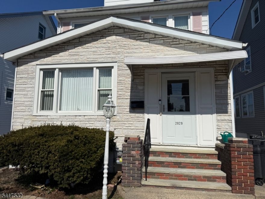 Come see this well maintained 3 bed, 2.5 bath with a finished basement, and walk-up attic waiting to be finished! A True Gem... waiting for you to make it yours!  You are greeted with an enclosed porch leading to the foyer entry and a spacious Formal Living room, & Dining Room with a bright & light Sunroom /Sitting Room. Dining Room is open to the Large Kitchen w/ breakfast nook, small island, and lots of cabinets. Coffee bar plus additional bonus room/Dinette area off the kitchen with built in storage seats, & backdoor leading to the backyard w/ a nice  Patio area, built in bbq,  and extra large 2 car Garage with extra-long paved driveway for off street parking/multiple cars. The Second floor boasts a spacious Primary bedroom, full Bath w tub, 2 smaller bedrooms &  don't forget the wood staircase to the  Dormer Style Walk-up Attic with plywood floors for storage--the possibilities are endless  for this extra space!  Newer Gas Furnace/Boiler, Water Heater and Newer Windows too! Side door separate entry  can also access the Great Family Room space in the Finished Basement area with half bath, StorageRoom, and a Large Laundry /Utility Room w full Sink.  Plenty of storage space in this house!   Great location-Close to many Stores, Restaurants and Major Highways...Perfect for Commuters!