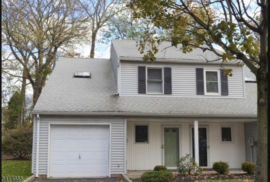 Welcome to this well-loved end-unit townhome in Crestwood Commons, a quaint community of just 18 residences offering privacy and a peaceful setting. This 2-bedroom, 1.5-bath home features an open main level and sliding glass doors leading to a rear deck, perfect for relaxing or entertaining. An attached garage adds everyday convenience. Ideally located near shopping, banking, and train stations, this home offers great space, location, and potential to make it your own. *AS IS and can offer a quick closing!