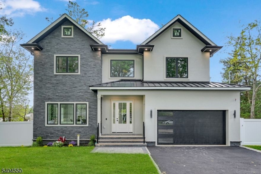 Welcome to this stunning NEW CONSTRUCTION 6 bed 5 bath home in a fabulous neighborhood in Short Hills located just minutes from the train station, vibrant downtown, & top-rated schools. Step into a 2-story foyer that sets the tone for the luminous interiors, filled with abundant natural light and gorgeous designer finishes throughout. The open concept living and dining rooms provide a refined backdrop for entertaining, while the gourmet chef's kitchen is a true showpiece, boasting custom cabinetry, high-end appliances including a beverage fridge and a custom pantry closet. The kitchen flows seamlessly into the stunning family room, anchored by a striking stone-clad fireplace & sliders leading to the FLAT backyard. A convenient 1st-floor guest ensuite & custom mudroom complete this level. Upstairs, retreat to the gorgeous Primary Suite, featuring 2 large walk-in closets & a spa-inspired bath w/ soaking tub, dual vanities & glass-enclosed stall shower. A Junior Ensuite, 2 additional bedrooms sharing a gorgeous hall bath & an upstairs laundry room complete the level. The fully finished lower level incld. spacious recreation room w/ wet bar, a guest bedroom with WIC & full bath, plus abundant storage. Outdoors, enjoy a FENCED-IN side and backyard, perfect for leisure, play, and entertaining. Backed by a 10-year builder's warranty, this residence offers the ultimate blend of luxury, location, and peace of mind.