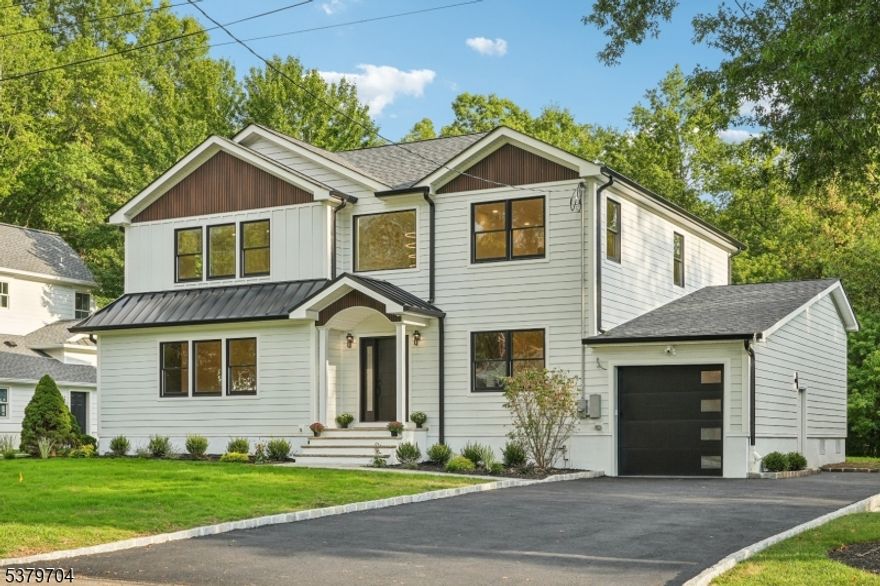 Modern Elegance meets Timeless Colonial Charm.  Beautifully renovated from the foundation up.  This custom Colonial is perfectly positioned on .28 acres of level land which delivers the perfect setting for entertaining your guests.  Designed for today's modern lifestyle, this 4 bedroom, 3.1 bathroom home features a thoughtful layout, including a 1st floor bedroom with bathroom.  A custom mudroom and full walk in pantry.  High end fixtures & finishes grace every room, while the stylish fireplace adds to the ambiance.  Top luxurious Appliances are throughout the kitchen.  The finished basement level offers flexible living space for work, play, media or fitness.  Dual zone heating and cooling. Top rated schools and minutes from 2 local train stations.  This home offers luxury and location.   Please confirm new real estate taxes.