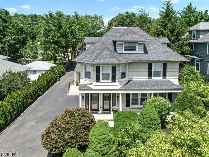 Step into this beautifully appointed 3-bedroom, 2-bathroom 1st floor unit, a decorator's dream, in highly sought-after Ridgewood. Perfectly blending modern elegance & functionality, this spacious home features a cozy living room with a fireplace, a formal dining room & a chef's kitchen equipped with stainless steel high-end appliances, a kitchen island, sleek quartz countertops. Hardwood floors flow throughout, custom blinds & central air for year-round comfort. The primary bedroom suite offers a generous WIC, FP & marble bathroom with a glass-enclosed shower. The 2nd BR boasts ample closet space & the 3rd BR can be used as a home office. In house laundry & ample storage in the lower level. Walk out to paved patio, shared use of yard, 1 garage space & 2 driveway spaces. Ideally located just 1 block from the train station, Ridgewood's vibrant shops and restaurants. Owner will maintain landscaping & snow removal. Tenants pay for all utilities, renter's insurance required. pets conditional. Credit check/good credit required.