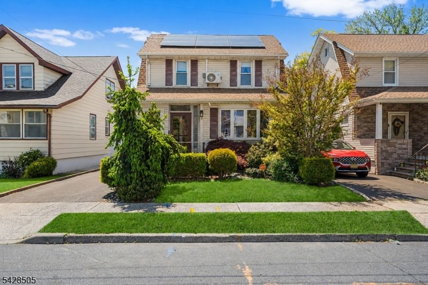 Welcome to this beautifully updated and well maintained 4-bedroom, 2.5 bath Colonial style home, offering the perfect blend of comfort, style & commuter convenience. Inside, you'll find gleaming hardwood floors & spacious rooms throughout, creating a warm & inviting atmosphere. The large 'working' kitchen is ideal for everyday living & entertaining. It features ample storage, a 5-burner stove, sleek graphite-colored appliances, granite counters & a modern glass tile backsplash.  The Open Floor Plan design provides spacious living areas that offer flexibility & seating options.  Enjoy year-round relaxation in the sunlit, enclosed front porch.  The rear yard offers your own private backyard retreat. The landscaped lot showcases an in-ground pool surrounded by elegant stone decking perfect for summer gatherings or quiet evenings at home. Owned solar panels provide energy efficiency & long-term savings (@ $178/mo.).  Temperature controlled attic offers additional finished space.  Ideally located near major roadways (Rts 1/9 & 27, NJ Turnpike, GS Parkway.) This home offers quick & easy access to NJ Transit Northeast Corridor trains and bus lines with convenient service to NYC & points South.  Minutes to Newark Liberty International Airport making travel a breeze. Close to downtown & regional shopping, notable restaurants, community offerings, Houses of Worship and Kean University.  A true move-in ready home with space, amenities, and an unbeatable location.  This one won't last!!