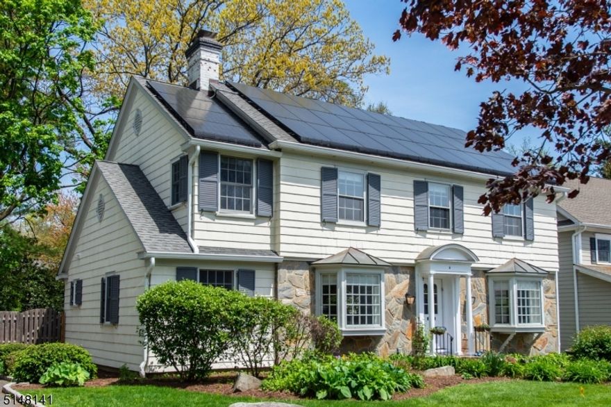 Beautiful curb appeal welcomes you to this Stunning Center Hall Colonial situated in one of the most desirable areas of Upper Montclair.  With custom detailing and upgrades thruout, this home has been meticulously maintained by the current owners.  The 4 BRs and 3 1/2 baths offer a 1st floor inlaw or au pair suite with full bath; the open floor plan features hardwood throughout - Gourmet Kitchen with extensive custom cabinetry with glass displays, granite, Breakfast bar and open to a 22x18 Family/Great room with built ins, recessed lighting and access to the rear yard perfect for entertaining.  The arched entries to LR (wood burning custom surround fireplace, bay window) and DR (shadowbox molding, corner period built ins, bay window) create a traditional/contemporary ambiance that will impress the most discriminating buyer.  From the Solar panels - owned not leased - to the smart thermostats, system upgrades throughout and radiant floors, to the incredible MBR Suite - 20x13 plus 11x7 Sitting area and 14x13 luxurious master bath w/ oversize double shower, dual vanities & 2 customized wi closets, this home has so much to offer.  The lower level 19x12 Recreation room/office/flex space and powder room is adjacent to the weight & utility/laundry rooms. With newer ACs and a high end Bederus furnace system - every detail in this property is quality.  Brookdale Park at end of block - city bound buses and midtown direct trains, 'Mt. Vernon' offers a wonderful community and lifestyle!