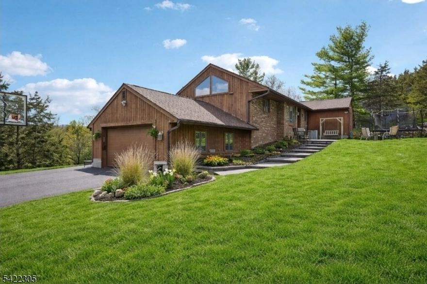 Discover a rare high-end sanctuary where luxury meets adventure. Perfectly positioned as a premier primary residence or a high-yield short term rental, this 3-bedroom, 3-bathroom estate offers a lifestyle unmatched in North Jersey. Enjoy the ultimate convenience of being walking distance to the Appalachian Trail, where you can explore scenic mountain right from your front door. Spend your summers lounging by the private pool and your winters just 10 minutes from the slopes of Mountain Creek. You are also only 10 minutes from the vibrant dining, boutiques, and seasonal festivals of Warwick, NY. Beyond the main living quarters, three additional rooms downstairs provide endless flexibility for guest suites, a home cinema, or a private office or gym. Bright, airy, and meticulously maintained, 5 Bucky Lane is the definitive standout property for the discerning buyer.