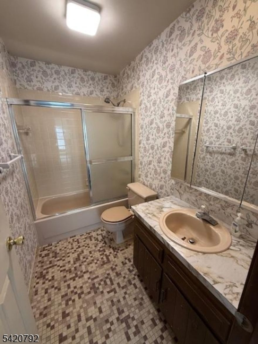 2 Bedroom Ranch Style End Unit with 2 Car Garage. Walk out Basement onto Patio. Home is in need of some TLC.