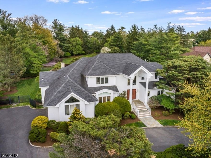 Impeccably designed and maintained Bel Air home on over 1 acre of property.  Step into this 5 bedroom, 4 full/3 half bath home with soaring ceilings and your eyes will immediately be drawn to the resort-like landscaped backyard which features a stunning deck with outdoor kitchen, overlooking the salt water heated pool and hot tub, as well as a huge separate play area away from the pool.  The gorgeous main level primary bedroom suite includes coffered ceilings, slider access to the backyard deck with a gas-fired fire pit, and a spa-like ensuite master bathroom with heated floors, a luxurious steam shower and dual walk in closets. The main floor also includes a large wood beamed chef's kitchen with 13' ceilings and top of the line appliances and cabinetry including 60 inch Viking professional burner plus griddle and double gas ovens, 2 sink areas, 2  dishwashers, a Sub Zero refrigerator, refrigerator drawers and a wine cooler. Right off the kitchen is a custom, wood raised paneled family room with gas fireplace.  Upstairs are three large bedrooms, one ensuite and another full bathroom, both bathrooms completely renovated in 2018.  The lower level features a state of the art home theater, a bar and billiards room, home office (or bedroom) with its own full bathroom and abundant storage.  Easy walking distance to multiple houses of worship.  Additional features include a Control4 Smart Home system, sprinkler system, whole house Generac generator and much more!