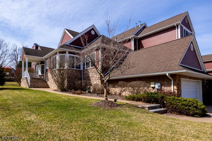 Crystal Springs Resort Living! Impeccably maintained end-unit ranch-style townhome in the sought-after Inverness community with mountain and golf course views and approx. 3,000 sq ft of finished living space. Enter through a private covered patio with southern exposure into a tiled foyer and freshly painted (2024) open-concept main level. The eat-in kitchen offers granite countertops, ample prep space, and scenic views, flowing into a sun-filled dining/living area with Andersen windows, vaulted ceiling, transom window, wood-burning fireplace, and sliders to a newer Trex deck. The primary suite features a tray ceiling, dual closets including walk-in, and a spa-style bath with double quartz vanity, soaking tub, and separate shower. A second bedroom includes its own ensuite bath. Main level also offers a powder room, laundry with utility sink, and walk-in storage. Hardwood floors with cherry inlay enhance the main living areas and bedrooms. The finished lower level is designed for entertaining with a custom wet bar, wine coolers, kegerator, built-ins, family room, full bath, office/gym space, additional storage, and mudroom with garage access. Updates include furnace, A/C, and water heater (2020), newer appliances (2022), and water softener. Enjoy low-maintenance living near golf, skiing, dining, hiking, lakes, wineries, and more.