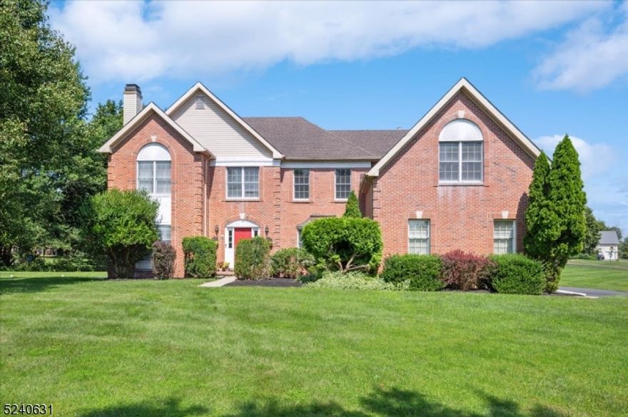 Elegant brick-front colonial with 4 bedrooms, 3   bathrooms, 3-car attached garage located on an idyllic corner + cul-de-sac 1.5 acres in a premier Montgomery neighborhood. This spacious home features cathedral ceilings, hardwood floors, dual staircase, and a beautiful backyard. The desirable open floor plan flows effortlessly between the 2-story open foyer, formal dining room, living room, powder room, and library with custom bookcases.  Two story open family room with a wood burning fireplace, and large gourmet dream kitchen with breakfast nook. Laundry/mud room and a side entry to the 3 car- garage complete this level. The 2nd level offers a beautiful hall with views to the elegant foyer and family room.  The exquisite large primary bedroom features a sitting room, walk-in closet, and a large convenient bonus room. The ensuite bathroom has dual sinks, stall shower and jetted tub with beautiful views of the property. Three additional bedrooms - one of them with an ensuite bathroom - and a hall full bathroom are on this level. The unfinished full basement offers endless possibilities. In a quiet, desirable neighborhood, top rated schools, easy NYC commute via direct train, minutes away from Princeton, this beautiful home is ready to move in.