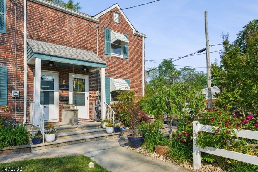 Beautifully renovated half duplex updated in 2022 including new furnace and AC! The interior features stunning shiplap ceilings, a modern kitchen with newer appliances, and a finished basement complete with a craft room/home office, gym, and laundry/storage area. Walk out to a gorgeous masonry patio oasis featuring two ponds, built-in fire pit seating, and mature landscaping with beautiful flowers throughout. Situated on a desirable corner lot, this home offers charm, comfort, and exceptional outdoor living.