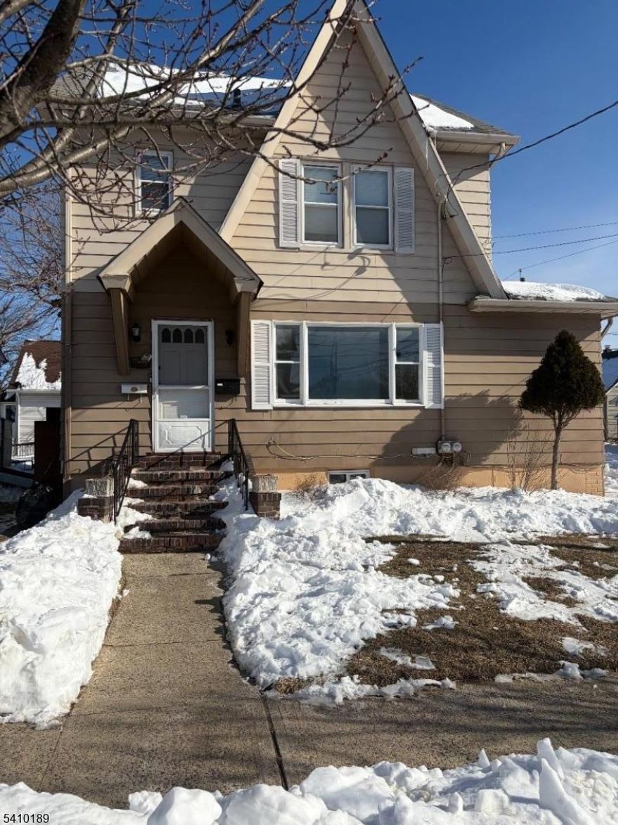 Large 3 BR 1st floor unit. EIK, LR, basement access ( storage only), use of yard. Updates include new bathroom, fresshly painted, some new flooring, new windows, new dishwasher, marble counter top in kitchen.   Close to major highways, NYC bus, shopping, restaurants and more. Tenant to supply refrigerator, laundry hook ups available. Landlord will provide lawn service, tenant responsible for snow removal.