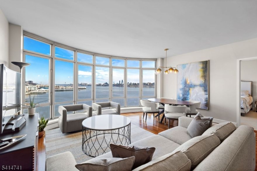 Welcome to The Watermark, North Bergen?s pinnacle of waterfront luxury. This elegant 2-bedroom, 2-bath apartment offers breathtaking Hudson River and Manhattan skyline views, a sunlit open layout, and a gourmet kitchen with stainless steel appliances and granite countertops. The primary bedroom features an en-suite bath, while both bedrooms boast generous closets and oversized windows.Residents enjoy unmatched amenities, including a 24-hour concierge, fitness center, indoor/outdoor pools, a lounge, and a screening room. Perfectly situated for effortless commuting via NY Waterway, NJ Transit, or major highways, The Watermark is minutes from Edgewater, Hoboken, and plenty of shopping, dining, and parks. Includes garage parking for one car.