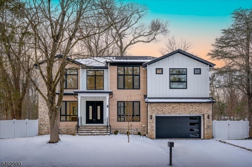 Brand New Construction by NJGCB, a leader in Modern Architecture and Design. HOME UNDER CONSTRUCTION - WORK WITH BUILDER TO SELECT FINISHES.  Contemporary Style meets Luxurious Living in this stunning Custom Smart Home with over 4,600 sq ft of livable space spanning three levels.   An Impressive Home with Grand Foyer, Floor to Ceiling Windows & Modern Glass Staircases.  First Floor w/10ft Ceilings, Formal Living Rm & Formal Dining Rm w/ Butler's Pantry.   2-Story Family Room w/ 18ft Ceilings, Gas FP & Sliders leading to Outdoor Entertaining, including Deck, Covered Paver Patio and Stone Gas FP.   A thoughtfully appointed Gourmet Kitchen w/ High End SS Appliances, Walk-in Pantry, Custom Cabinetry & Large Island w/Quartz Waterfall.  Private First Floor Guest Suite w/ Bedroom & Full Bath.  Mudroom & Powder Room complete first floor.  Second Floor w/9ft Ceilings includes a Luxurious Primary Suite w/tray Ceilings, Private Balcony, Custom WIC's & Spa Bath w/soaking tub, Heated Floors, Dual Vanity & Water Closet. Three Large Guest  En Suite Bedrooms, Separate Home Office & Laundry Room.  Finished Walk-out Basement w/ 9ft ceilings, Bedroom, Bath, Media Room w/ Soundproofing & Speakers, Rec Room w/ Wet Bar & Appointed Gym w/rubber flooring & mirror wall.  Landscaping includes Sod, Irrigation System, 6ft Privacy Fence, BBQ Gas Line. Plenty of room for Future Pool.  May 2026 Completion.  Pictures are from 47 Falcon Road which has similar layout and finishes.