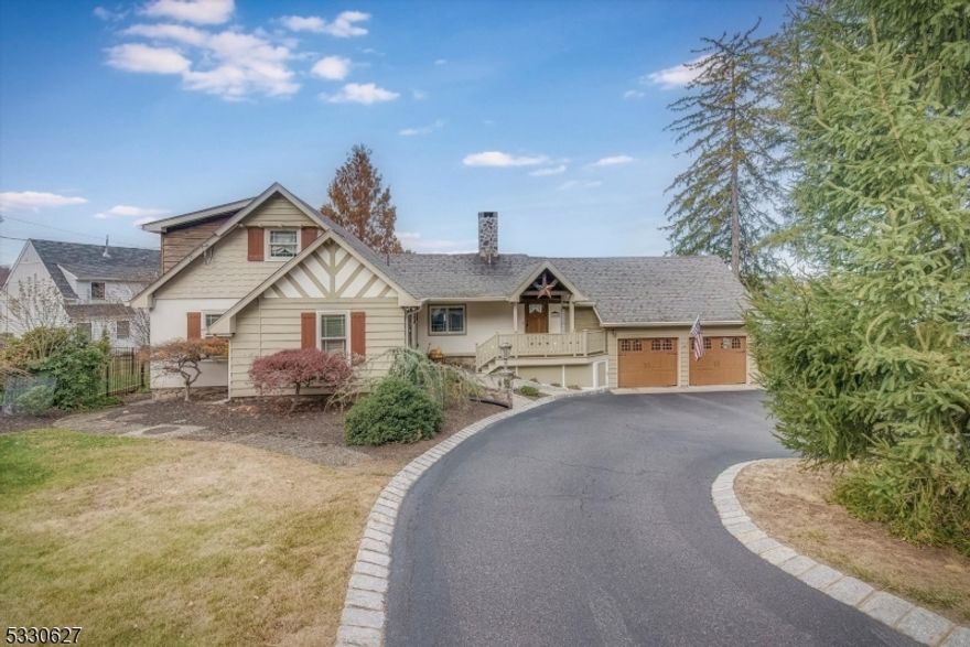 Welcome to your impeccable Lakestyle home on Lake Mohawk. Step into this stunning original Crane lakefront home, where charm meets modern comfort. From the moment you enter the covered entranceway, you'll be captivated by the design & breathtaking views. The foyer has high-beam ceilings, a double cedar coat closet, & access to the 2-car garage, a cedar-covered back porch w/ceiling fans overlooking the scenic Boardwalk. Living room is cozy yet elegant, featuring Pecky Cypress walls, hardwood floors, a stone Crane fireplace w/an insert & soaring high-beam ceilings. Formal dining room is framed by a wall of windows showcasing stunning lake views. The modern kitchen has efficient space w/a Bosch dishwasher leading to a laundry room w/a pantry. 2 spacious bedrooms w/hardwood floors & an updated full bath featuring a tub complete the 1st floor. Upstairs, the primary suite is a private retreat boasting teak floors, a luxurious full bath w/double vanities w/solid brass hardware, & a dressing room/walk-in closet offering abundant storage. The walkout basement is unfinished w/high ceilings, offering endless potential for a Great Room, leading to a backyard oasis. Outdoor features include stone fireplace, hot tub, & manicured lawn leading to your private floating docks. 120' road frontage & 110' lake frontage. Nat gas, central air, central vac & 200-amp service. Andersen windows throughout. Walk-up attic. Enjoy the annual LMCC fireworks w/panoramic views both inside & outside the home.