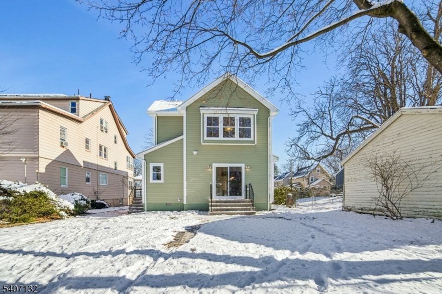 Welcome to 135 Union Avenue, where classic Maplewood charm meets complete modern luxury. Originally built in 1922 and fully renovated from top to bottom in 25/26 by the highly acclaimed Lefko Brothers, this home is essentially brand new construction. Everything is new, including siding, roof, windows, electric, plumbing, heating and cooling, kitchen, bathrooms, and all finishes. The first floor offers the perfect blend of open living with defined spaces. A beautiful mudroom with custom woodworking sits off the driveway, along with a stylish powder room. The formal living and dining rooms flow into an open kitchen and a spacious family room with a gas fireplace. Sliding doors lead to a flat backyard with a patio and a rare 3 car garage. The second floor features three generous bedrooms, including a stunning primary suite with two closets (one walk-in) and a luxurious en suite bath with double vanity, glass shower, and heated floors. A laundry room is conveniently located just outside the primary bedroom. The third floor adds two more bedrooms and a brand new full bath. The finished basement includes a large rec room, full bathroom, and utility and storage areas. With brand new central air and heat, exceptional craftsmanship, and a prime Maplewood location, this home offers turnkey living at its finest.