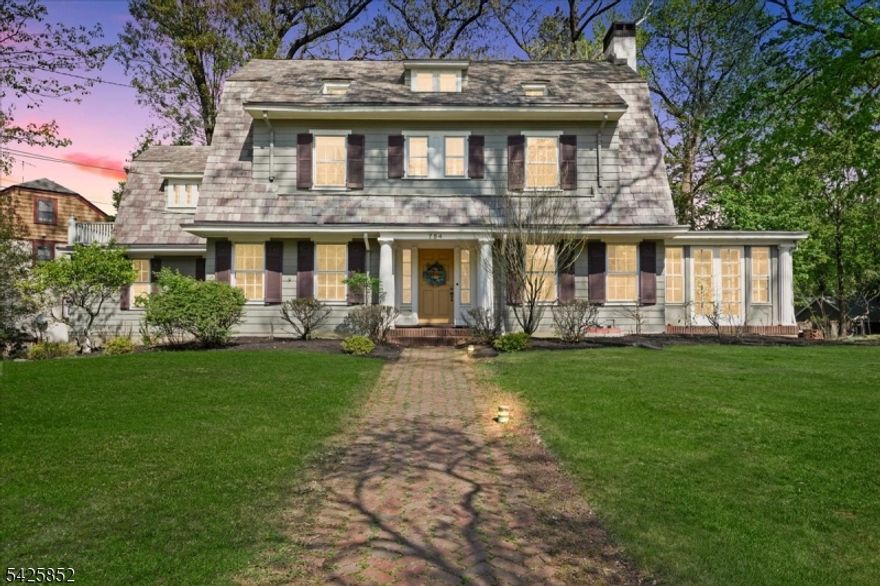 SITUATED IN THE HEART OF THE NETHERWOOD HEIGHTS HISTORIC DISTRICT, this timeless 1927 Center Hall Colonial offers classic charm with modern updates. A welcoming grand foyer with a sweeping staircase leads to the upper levels. The first floor features an updated kitchen with a separate breakfast room, a spacious formal dining room, and a bright living room with a wood-burning fireplace. A sun-filled family room, powder room, and screened porch complete the main level.The second floor includes three generously sized bedrooms, a laundry room, and an office/TV room. The third level offers two additional bedrooms and a full bath, providing flexible living space. The finished basement includes a recreation room, exercise area, office, craft room, storage, and a full bath.Additional highlights include distinctive architectural details, a back staircase,  a slate roof, built-in bookshelves,  a two-car attached garage, a porch, a patio, and more. This five-bedroom, four full and one half bath home is a must-see.