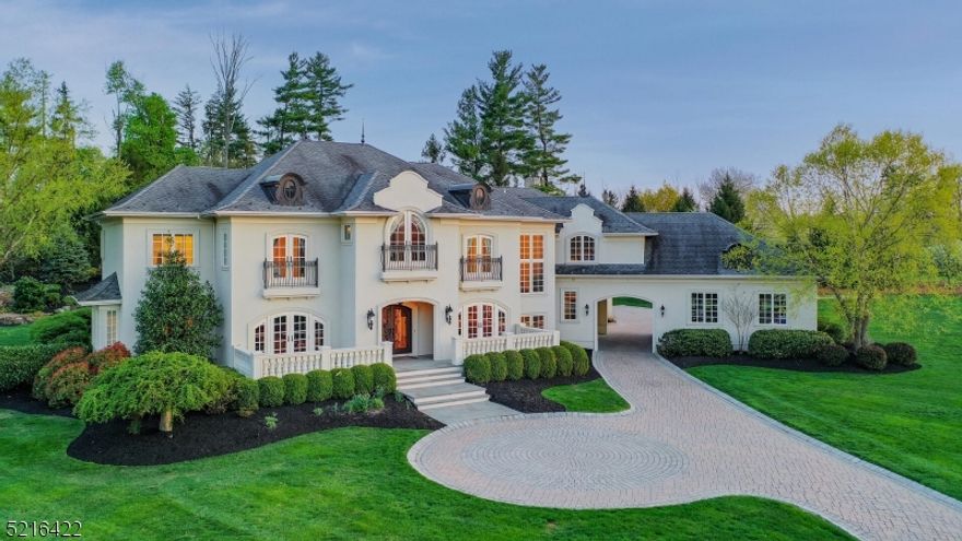 French Chateau inspired property of nearly 12,000 sq ft of living space with special amenities including elevator for easy accessibility between levels, first floor guest suite and multi-zoned radiant heated floors including basement and garage. Enjoy a 4,200 sq ft, finished walk out lower level of 10 ft ceilings, movie theater, expansive bar, gym, full spa bathroom with sauna, workshop, 2nd laundry room, multiple entertainment areas and potential 6th bedroom ensuite. Decompress in your heated Gunite in-ground pool complete w/ natural waterfalls, waterslide, hot tub, artificial turf putting green, fire pit,  and retractable screen covered porch offering outdoor kitchen, gas fireplace, TV and built-in heater. Leonardis designed gourmet kitchen containing Dacor gas range, 3 ovens, warming drawer, separate full-sized Sub-Zero fridge-freezer and 2 Bosch dishwashers. Entertain in fully equipped first floor bar area adjacent to a temperature controlled walk-in wine cellar & humidor. Upstairs hosts all ensuite bedrooms, upstairs laundry and multi-use loft area. Primary suite is complemented by oversized his/her separated closet space and retractable screen covered balcony overlooking the backyard oasis. Enjoy your privacy with a 5-acre zoned preserve located directly behind the property.