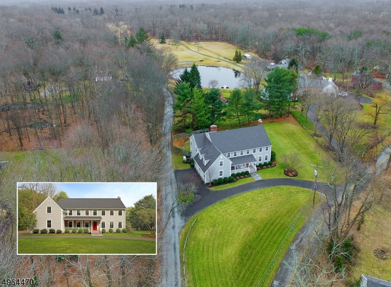Extensively updated classic Colonial, yet modern w/all the upgrades! Beautiful & grand 2-story LR w/soaring stone FP symmetrically flanked by architectural windows.  Open Kitchen w/Granite & Stainless appliances. Vaulted ceilings in parlor off kitchen & 3-season porch, Large bedrooms & oversized Master suite with office/gym. Melt away stress in the Ultra-Luxurious Master Bath w/radiant heated floors, Jacuzzi tub, glass-enclosed shower & heated towel rack. Newly built mudroom w/all the right cubbies, storage & nooks! The best Harding has to offer... low taxes, manageable property, beautiful bucolic scenery w/close proximity to Train & shopping. A quick walk to hiking trails & Federal wildlife preserve on a Cul-de-sac street!