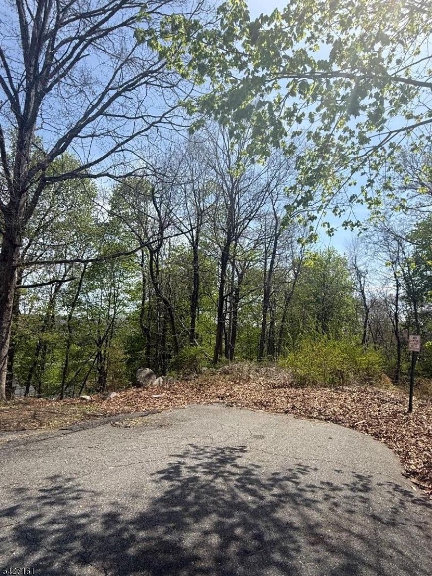 Tucked at the end of Winding Hill Rd, this wooded parcel offers a quiet, tucked-away setting with plenty of potential in Hopatcong. Surrounded by nature and set on a peaceful stretch of road, it's a great opportunity for buyers looking to secure land in a desirable lake life neighborhood. The property features lake views, adding to its natural appeal.Enjoy the privacy while still being just minutes from local dining, shopping, and outdoor recreation, including nearby public lake access and parks. A unique chance to own a slice of Hopatcong with flexibility for future possibilities.Buyer is responsible for all due diligence, including but not limited to zoning, utilities, permits, and approvals.