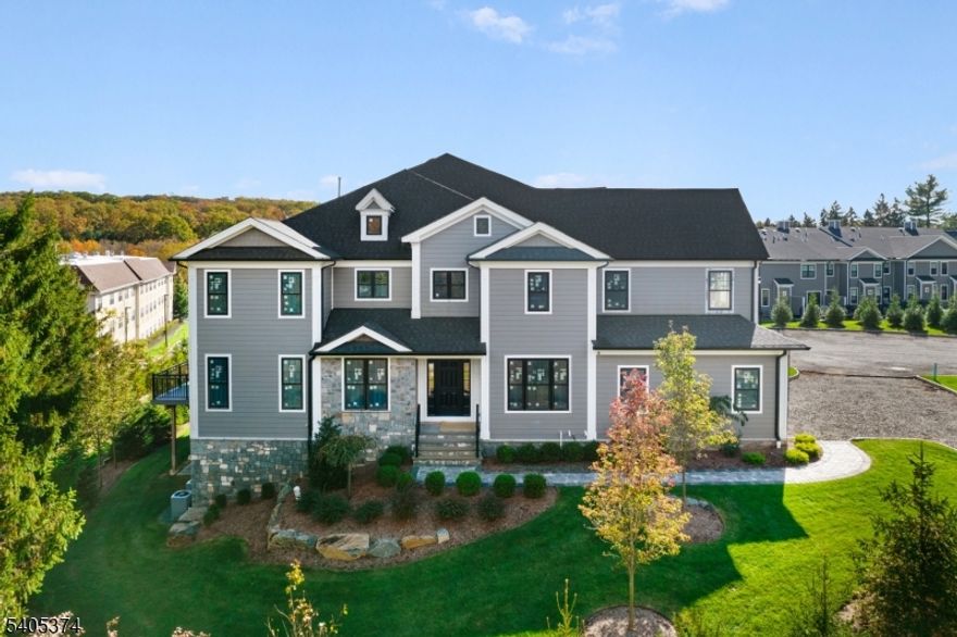 Welcome to this stunning modern 3-bedroom townhome, thoughtfully designed with high-end finishes and exceptional living spaces throughout. Located in a quiet, private development, this home offers the perfect blend of luxury, comfort, and functionality. The main level features a spacious open-concept layout, ideal for both everyday living and entertaining. Designer finishes, wide-plank flooring, and upscale details create a refined yet inviting atmosphere. The gourmet kitchen seamlessly flows into the living and dining areas, making it the heart of the home. The fully finished basement expands your living space and includes a custom bar, perfect for hosting gatherings, movie nights, or relaxing at home. An additional bonus room provides incredible flexibility and can easily serve as a home gym, office, or creative studio. Upstairs, you'll find three generously sized bedrooms, including a serene primary suite designed for comfort and relaxation. The elevator provides convenience and ease, allowing access to all three levels. Completing the home is a rare 3-car garage, offering ample storage and convenience. With its modern design, premium finishes, and tranquil setting, this townhome is a truly exceptional opportunity for luxury living.