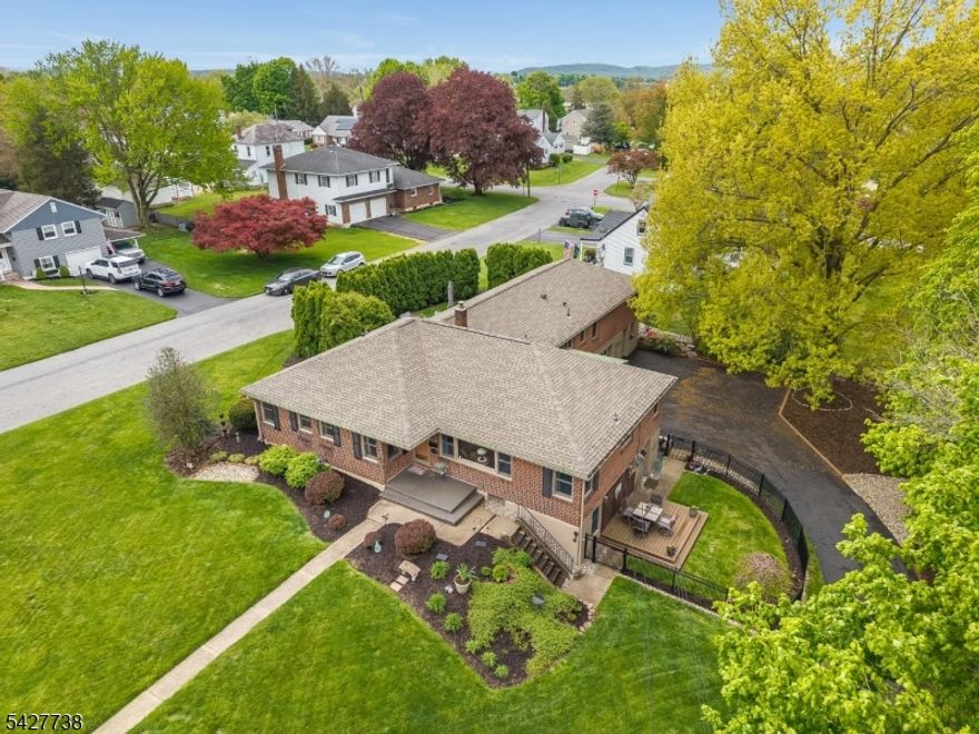 INCREDIBLE OPPORTUNITY! All Brick LEGAL TWO FAMILY!  Such a truly UNIQUE property with so many POSSIBILITIES!  Not only are there 2 Separate Full Living Spaces on the Main Level but there is also a Fully FINISHED WALK-OUT Lower Level also with a Legal BR, a Full Bath, Family Room, Exercise Rm with closet (could possibly use as a guest room) Rec Rm & Kitchenette! With approx. 4,000 sq ft of total living space and a grand total of 6 BR's, 4.5 Baths, 3 Car Garage and a Heated and Air conditioned Workshop, this HOME can accommodate a wide range of living arrangements. Main Section: LR,DR,KIT, Laundry, 1.5 Bath & 3 BR's! 2nd "Unit" on Main Level: KIT, DR/LR COMBO, DEN 2 full Baths (1 is HANDICAP Accessible) and 2 BRs! The 2nd "Unit" can be accessed from within the main house AND through a private exterior door.  That unit has it's own address! 2 Interior Staircases to the LL. Pull Down for Attic. You can rent these spaces out OR you can live in one and Rent the other! The options are endless! 8 Zone Nat GAS hotwater Baseboard Heat! C/A! All Appliances Included! All of this is Nestled on a beautiful .45 acre corner lot located Just MINUTES to COMMUTER Rts & Most CONVENIENCES! This is a Great Home with a ton of special features! Andersen & Pella Windows! Generator Hook-up! Hardwood! TILED Baths! Several different outdoor spaces which include composite deck, wood deck, covered porch and beautiful patio! Mature landscaping! Hurry, you will not want to miss out on this RARE FIND!