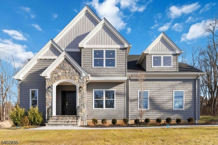 Exceptional new luxury home that blends classic style with clean contemporary finishes & open living spaces.The exterior of the home presents with crisp siding & a stone covered welcoming entryway leading into a bright and airy interior. High ceilings throughout the home create a light-filled atmosphere while maintaining a traditional feel.The main level features an open-concept layout designed for today's lifestyle.Expansive kitchen equipped w/ modern cabinetry, quartz countertops SS appliances & a large center island. The kitchen opens seamlessly to a generous living rm with a fireplace making it ideal for entertaining. Hardwood floors, custom millwork & dramatic ceiling lighting add a refined yet modern feel. A formal dining area & powder room complete the main floor level.Upstairs the primary suite offers a private retreat with large walk-in closets & an en-suite bath with a double vanity, tiled shower, large tub & contemporary fixtures. Three add'l bedrooms are well-proportioned & share a beautifully finished full bath. A convenient 2nd floor laundry adds to the home's functionality.Throughout the home an ample amount of thoughtfully designed closet space enhances both comfort & organization.THE FINISHED BASEMENT SIGNIFICANTLY EXPANDS THE LIVING SPACE providing a bright & flexible area suitable for a family rm, media rm, gym or guest suite. Now imagine a house that feels right the moment you step inside comfortable, stylish & carefully crafted to make everyday life easy.