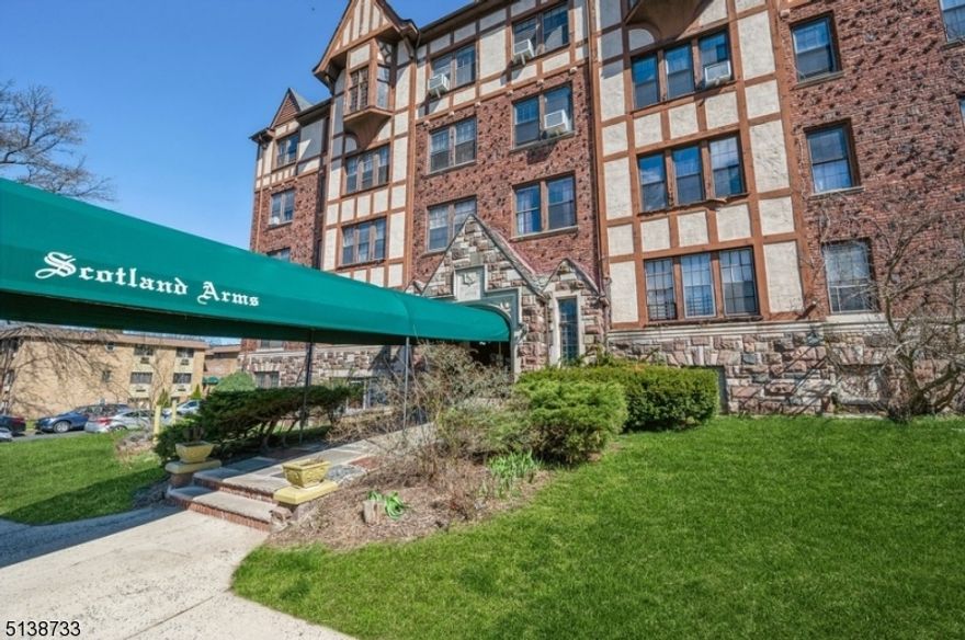 Comfort, quality, and style!Spacious and stunning one-floor condominium with three bedrooms and two full bathrooms is loaded with character and move-in ready! Nestled in a beautiful pre-war building on a quiet street about fifteen miles from Manhattan, it is convenient to Main Street shops and restaurants, New Jersey Transit stops, and huge nearby nature preserves.  The interior of this light-filled residence features high ceilings, Gothic arched doorways, warm hardwood floors, wide base and crown molding, multiple cedar closets, and ceiling fans in most rooms.The foyer opens to a large living room highlighting a charming brick fireplace with a carved wooden mantel. A wide archway opens to the formal dining room with a built-in corner cabinet and swinging door to the bright white kitchen. The kitchen features ample cabinet and counter space and a pass-through/breakfast bar connecting it to the dining room. Down the hall is the large primary bedroom with an en suite bathroom, two additional bedrooms (one with a walk-in closet), and a full hallway bathroom. Old world elegance and charm is on full display in the richly paneled lobby with a wide stairway to the mezzanine level where you'll find a gracious sitting room and elevator access. HEAT AND HOT WATER included in maintenance fee. Portable washer and dryer included plus laundry facility located in Basement area. Just one block away from the NJ Transit Mountain Station stop.