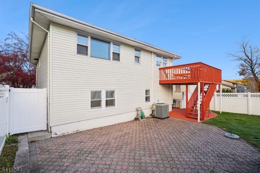 Don't miss this Large Private home set on lovely street with 2 Full Eat In Kitchens!!! Ground level boasting large 26x12 Living/Dining room with access to patio and yard. Eat in kitchen with large eating area lots of cabinet space and pantry, 2 bedrooms with large full bath and laundry room. Second level features bright open kitchen with breakfast/family room leading to large deck accessing staircase to patio and yard, formal living room and dining rooms complete the entertaining space. Three bedrooms on this level include a Large primary suite with walk in closet, double closet and a primary bath and new vanity, 2 additional bedrooms on this level and hall bath make this the perfect home!. Just blocks to houses of worship, stores, grammar & high school. Public transportation to NYC and easy access to Rt 280.