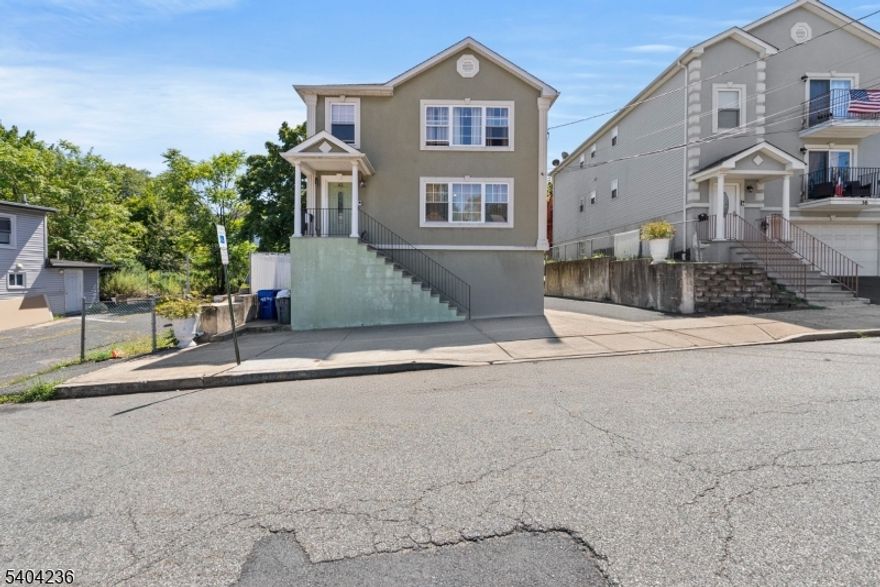 Experience refined modern living in this newer constructed two-family residence, ideally located in Paterson just minutes from Haledon. Each spacious unit features 3 bedrooms and 2 full bathrooms, highlighted by a luxurious master suite with a private en-suite bath your personal retreat.The thoughtfully designed main living areas flow seamlessly into a fully finished basement, offering remarkable flexibility with additional rooms and a second full bath .Step outside to enjoy your own private backyard, a serene escape ideal for entertaining guests, gardening, or simply relaxing in comfort. More than just a home, this property presents an exceptional opportunity for sophisticated living, blending style, space, and practicality in one elegant package.The original property was built in 1888; however, it was fully rebuilt and expanded in 2011.