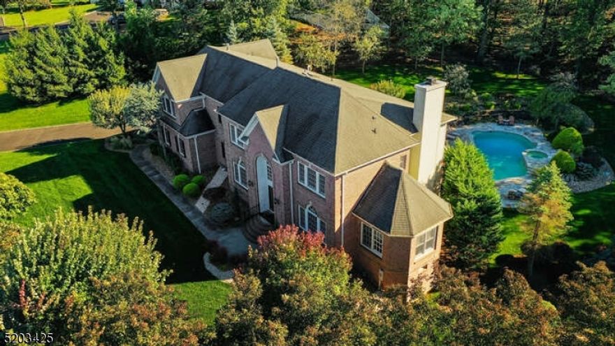 Exquisite upgraded 5BR, 5.1BA home, sits atop Watchung Mountains, boasts luxurious features, fine finishes & numerous upgrades! Over 6000+sq ft of living space (4,601 plus 1500+ LL). Gourmet kitchen is the heart of the home fully equipped w top-of-the-line appliances: Sub Zero ref, Jenn Air double oven, Bosch DW, & Viking 6 burner gas cooktop, all surrounded by newer Quartz counters + butcher block center island & sun-filled breakfast area leads to expanded maintenance-free deck. Gracious 2 story family room w/ fireplace is bathed in natural light that floods in from the picturesque windows and sliding glass doors. Handsome home office with built-ins and mountain views. 1st fl BR & full bath is perfect for guests or multi-generational living. The true showstopper is the backyard oasis with southern sun exposure with heated, gunite, saltwater pool ideal for relaxing on warm summer days. A beautifully designed patio w/ Rainscape covering adds even more outdoor living space no matter the weather. Spacious & luxurious MBR suite features tray ceiling, picture windows overlooking the tranquil backyard & double-sided gas FPL, 2nd office/dressing room & 3 huge customized walk in closets. 2 add'l en-suite BRs & 1 BR complete the 2nd fl. Finished lower level is an absolute gem w/ walkout that leads to the gorgeous outdoors & features a flexible layout equipped with full BA, recreation, media & game rooms & kitchen that includes a dishwasher, sink, & refrigerator. Built-in generator.