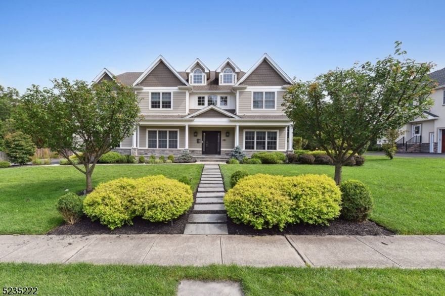 Welcome to this stunning home located on one of Westfield's most desirable streets, overlooking the picturesque Echo Lake golf course. Upon entering, you will be greeted by a spacious 2-story foyer w/ an open staircase. The formal living & dining room exude sophistication with their tray ceilings & custom moldings. The gorgeous eat-in kitchen boasts a center island, breakfast bar, exquisite marble countertops & top-of-the-line professional-grade SS appliances. The separate breakfast room is bathed in natural light & a butler's pantry with a wet sink & wine refrigerator adds a touch of luxury. The family room is a cozy retreat with its coffered ceiling & gas fireplace flanked by custom built-in shelving & storage. The 1st floor also offers an en-suite bedroom w/ a private bath. A mudroom & powder room round out the main level. Moving to the 2nd floor, you'll discover the primary bedroom featuring high ceilings, a gas fireplace, a walk-in closet & a dressing room. The en-suite bathroom is a true retreat w/ a jetted tub, stall shower & dual sink vanity. This floor also includes another en-suite bedroom w/ a private bath, 2 additional bedrooms connected by a Jack-n-Jill bathroom & a laundry room. The finished basement features a recreational room, media room, exercise room & a full bath. Outside, the fenced backyard ensures privacy while enjoying the paver patio. Whether you're a homebody or a host, this property ensures you'll live your most comfortable, luxurious life.