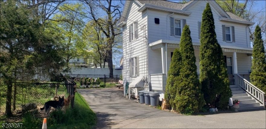 Great investment opportunity to own this two family house.  Both units rented. Second floor has open porch, foyer, washer, dryer, one large bedroom and living room with gorgeous hardwood floors and eat in kitchen.  First floor has two large sized bedrooms, living room, kitchen and full finished basement, with full kitchen, plenty of cabinets, utility room and storage.  Massive fenced in yard, possible subdivision.  Must check with town regarding variance.  House being sold strictly "As Is."