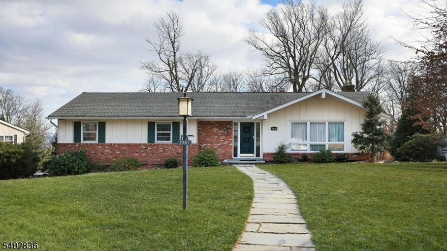 Spacious Ranch Style Home for Rent in Mountainside NJ. Welcome to this charming home nestled on a quiet street in the scenic Watchung Reservation neighborhood. The features of this home include 4 comfortable bedrooms, 3 full baths, an eat in kitchen and an expansive living room and dining room. A sunroom/den with sliding doors leading to the deck and skylights for maximum natural light complete the main level of the home. The 4th bedroom is on the lower level complete with a full bath, kitchenette and direct access to the patio and backyard. The oversized 2 car garage provides an abundance of extra storage and space.The property provides a serene backdrop, while still being conveniently located in close proximity to highways, transportation, shopping and top rated schools.This home offers a blend of space, comfort and convenience. Don't miss an opportunity to rent this home.