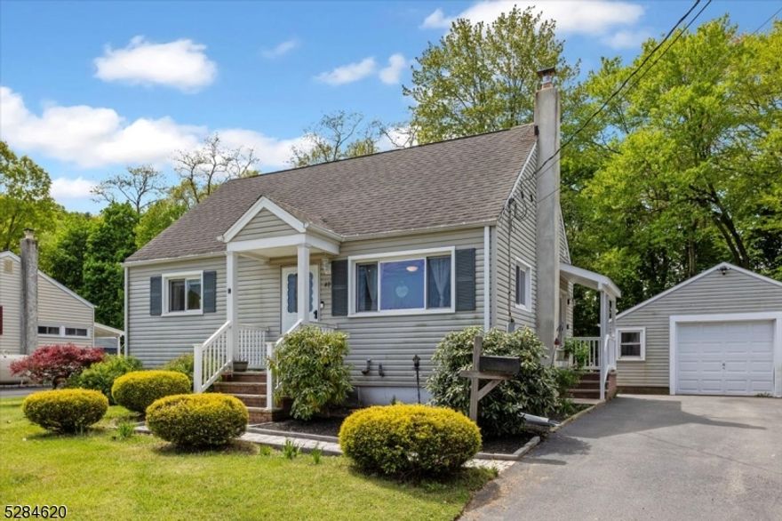 Welcome to your ideal Cape Cod nestled in a serene setting with breathtaking lake views. This picturesque property boasts optimal living conditions across 6 spacious rooms, including 4 generously sized BDR. As you arrive, a sense of tranquility envelops you, featuring a detached 1-car garage and a 2-car width blacktop driveway offering ample parking. The exterior, adorned with durable newer vinyl siding & windows ensures low maintenance and energy efficiency. Upon entering, you're greeted by an updated kitchen, the heart of the home, featuring custom-built cabinets and new hardware. The addition of butcher block countertops adds warmth and character, complemented by a custom-built butcher block kitchen table. Hardwood floors flow throughout the spacious layout including a partially finished basement, offering additional living space for recreation or storage. Central air conditioning ensures year-round comfort. Notably, the home features leased solar panels, providing eco-friendly energy solutions and significant cost savings at just $75 per month. Convenience is key, with easy access to transportation from nearby NJ Transit Mount Arlington station offers travel to New York City, making it an ideal location for those seeking both tranquility and accessibility. In summary, this Cape Cod gem presents a rare opportunity to enjoy the epitome of comfortable, lakeside living and easy access to urban amenities. Don't miss your chance to make this idyllic retreat your own.