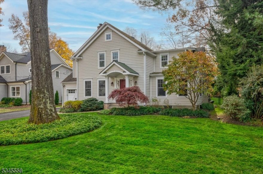 Welcome to this exceptional home in a sought-after neighborhood close to schools, downtown, and trains. The exterior features beautifully landscaped grounds with lush lawns and manicured shrubbery, while inside elegant architectural details and designer touches are bathed in natural light. The spacious living room, with a cozy fireplace flanked by built-ins, flows into the formal dining room perfect for entertaining. The new chef's kitchen offers professional-grade appliances, a large island, ample cabinetry, and quartz countertops along with a separate ice machine.  With outdoor access, the transition to the level backyard and paver patio is a breeze. A first-floor office, den, and full bath provide a potential guest suite. A powder room and a mudroom with built-ins and garage access add convenience. Upstairs, the primary suite is a luxurious retreat with a sitting area and spa-like bath featuring a soaking tub, separate shower, dual-sink vanity, and private toilet. Three additional bedrooms, including one with an en-suite bath, plus a hall bath and second-floor laundry, complete the level. The lower level boasts a spacious family room with built-ins, a gym, an additional office area, and a powder room.