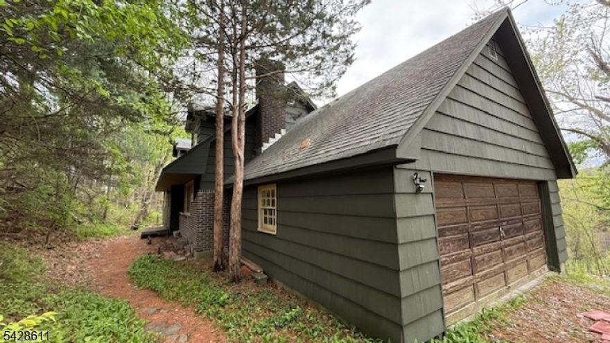 Investor opportunity with strong upside potential. This Cape Cod, built in 1976, is currently configured as a two-bedroom, one-bath home with an unfinished second level that is ready for completion. The upper level offers roughed-in electrical and plumbing, providing the opportunity to expand to a four-bedroom, two-bath layout with approximately 2,000 square feet of living space. The property includes a four-bedroom septic system already in place.Set on slightly over one acre of private wooded land, the property offers a natural setting with added potential. This home requires renovation and is ideal for buyers looking to customize or add value. An in-ground oil tank is present and will need to be removed at the buyer's expense. Property is being sold strictly as-is, with the seller making no repairs or offering credits. All inspections, certifications, and certificate of occupancy requirements are the responsibility of the buyer.