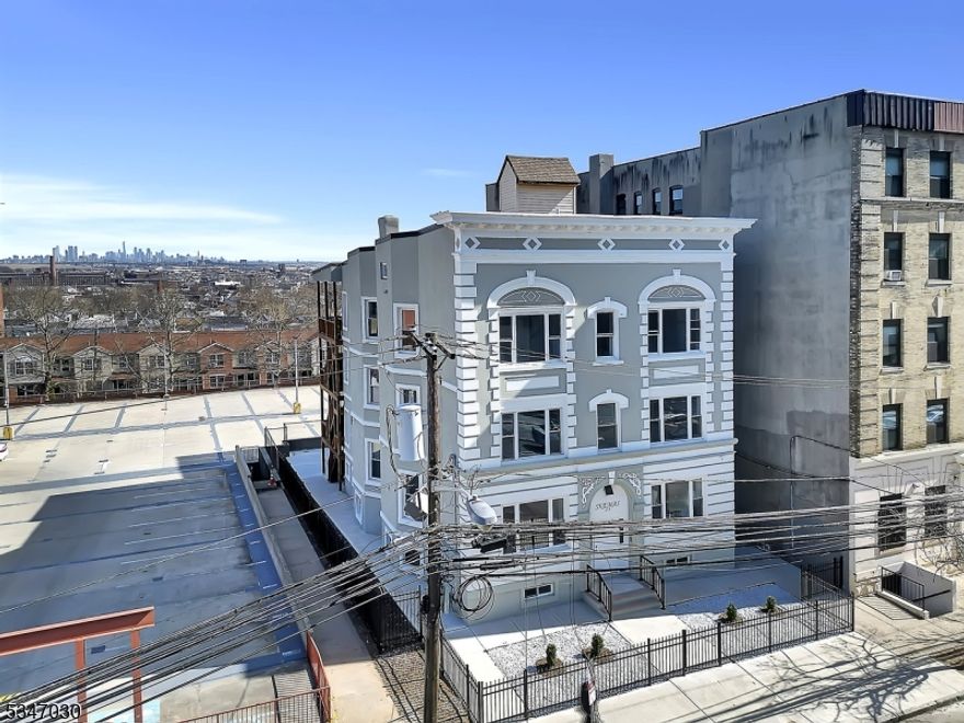 A 5-YEAR TAX ABATEMENT. A unique and rare investment opportunity awaits in the vibrant North Newark area! This prime location sits directly across from the stunning Cathedral Basilica of the Sacred Heart and is just steps from Branch Brook Park. With a two-minute drive to Route 280 and easy access to Newark Penn Station, this property offers unbeatable convenience. We proudly present this exceptional newly rebuilt, gut-renovated building, featuring 14 modern one-bedroom apartments. Each unit is thoughtfully designed with Open-concept layouts, Stainless steel appliances,  Washer & dryer hookups, Ceiling mini-split heating & cooling systems.The impressive scale of the building includes 9'6" ceiling heights on its three main floors and 8' doors throughout, enhancing the sense of space and luxury. With high market demand, this is a great opportunity to start rents at competitive rates and maximize returns.Don't miss out on this exceptional chance to secure a financially promising venture in a sought-after area!