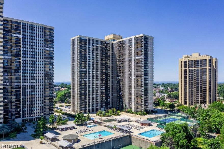 Welcome to this desirable corner-unit residence at 300 Winston Dr #210 in Cliffside Park, offering stunning New York City views and abundant natural light. This spacious 2-bedroom, 2-bathroom home features expansive floor-to-ceiling windows that wrap around the unit, creating a bright and airy living environment.The primary bedroom suite offers excellent storage with two walk-in closets, along with a full bathroom plus two convenient linen closets. The thoughtfully designed layout maximizes comfort and functionality.Enjoy seamless indoor-outdoor living with a full-length walk-out terrace, perfect for relaxing or entertaining while taking in the breathtaking NYC skyline views. Indoor garage parking available through association ($75/month single, $135 tandem). On-site post office.A rare opportunity to own a light-filled corner unit with exceptional views and generous living space. It's a perfect opportunity for a creative buyers.