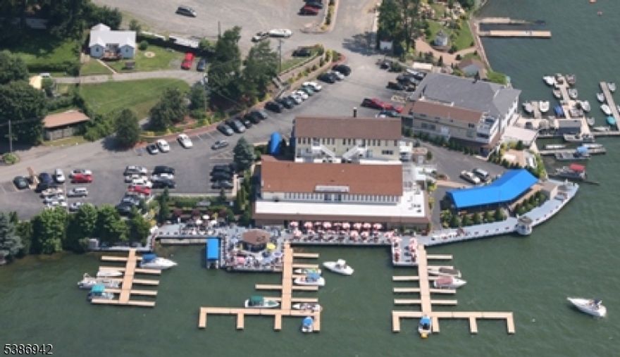 "The Jefferson House " "A Rare Gem on Lake Hopatcong!" Discover a unique investment opportunity that seamlessly blends residential, commercial, and recreational potential in one extraordinary property. For over 50 years, this iconic landmark on Lake Hopatcong has been lovingly owned and operated, offering endless possibilities for savvy buyers.The property features a versatile layout designed to support multiple revenue streams, including rental units, a successful restaurant, and a sophisticated banquet room. Its expansive outdoor patio accommodates over 200 guests, complete with a vibrant Tiki Bar and pub tables which is ideal for romantic dinners, casual gatherings, or hosting unforgettable events.  All this is set against the breathtaking backdrop of Lake Hopatcong. Renowned for offering the most spectacular vantage point on New Jersey's largest lake, the Jefferson House is easily accessible by both land and water, with several boat docks allowing for effortless arrivals by boat. Abundant parking ensures convenience for all guests, making it a hub for dining, entertainment, and leisure. Whether you envision expanding a thriving business or crafting a residential investment, the Jefferson House is a once-in-a-lifetime opportunity to own a cherished piece of Lake Hopatcong history. Don't miss your chance to make this remarkable property your own!