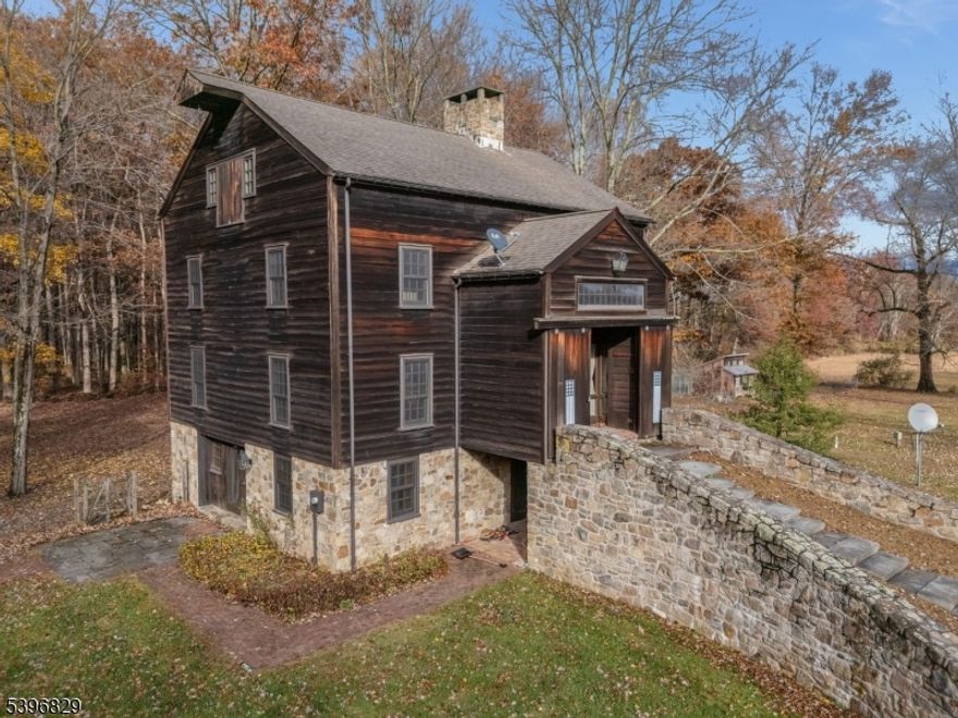 THERE ARE 2 HOMES ON THIS BEAUTIFUL 3+ ACRE PROPERTY THAT BACKS UP TO PARKLAND AND WALKING TRAILS!   THE MAIN HOME IS AN AMAZING CONVERTED BARN FROM 1880  FEATURING 3 BEDROOMS AND 3 FULL BATHS.  MUCH OF THE ORIGINAL CHARACTER HAS BEEN RETAINED WITH EXPOSED HEWN LOGS AND HAND-CRAFTED STONE WALLS.   AT GROUND LEVEL, THE CUSTOM EAT-IN KITCHEN WITH CENTER ISLAND FLOWS INTO A SPACIOUS RECREATION AREA WITH A FULL BATH AND WALKOUT TO THE PATIO. THE FIRST LEVEL FOYER LEADS TO A STUNNING GREAT ROOM WITH WOOD STOVE, FORMAL DINING ROOM, LAUNDRY ROOM, LIBRARY, AND FULL BATH. THE SECOND LEVEL OFFERS A LOFT WITH BEDROOM AND FULL BATH,  WHILE THE THIRD LEVEL FEATURES AN ADDITIONAL LOFT AREA, TWO BEDROOMS, AND ANOTHER FULL   BATH. CATHEDRAL CEILINGS, SKYLIGHTS, AND CUSTOM DETAILS THROUGHOUT MAKE THIS A TRULY UNIQUE HOME!  ENJOY COUNTRY LIVING AT ITS FINEST   CLOSE TO FARMS, SHOPPING, RESTAURANTS, AND LOCATED IN A BLUE-RIBBON SCHOOL DISTRICT!THE SECOND HOME IS A FULLY RENOVATED HISTORIC HOME WITH  3 BEDROOMS, 3 FULL BATH RESIDENCE CURRENTLY RENTED TO A LONG-TERM  LOW INCOME TENANT.    THIS HOME IS UNION TOWNSHIP APPROVED AS A LOW-INCOME PROPERTY (COAH) AND HAS A WAITING LIST.  THE TENANT MUST MEET COAH REQUIREMENTS. THIS CAN NOT BE CHANGED OR RENTED TO A NON LOW INCOME TENANT. THE CURRENT RENT IS $2200 PER MONTH WHICH IS THE MAXIMUM.  THIS HOME CAN BE SEEN ON A SECOND SHOWING ONLY.