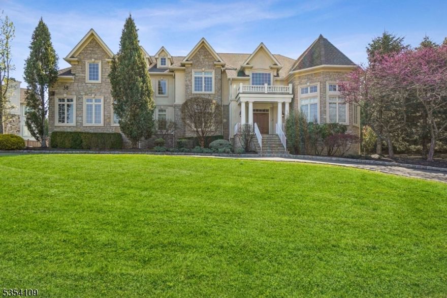 Welcome to 38 Lafayette Drive, a custom-built Center Hall Colonial nestled in the prestigious Bel Air Woods neighborhood of Livingston. This elegant 5-bedroom, 5.1-bath home offers over 6,000 square feet of living space on 0.60  acre lot with circular driveway. A grand two-story foyer sets the tone for the home's refined interior, featuring rich hardwood floors, a formal living and dining room with custom moldings, and a spacious home office with French doors. The gourmet eat-in kitchen is complete with a center island, high-end Viking and Miele appliances, and three dishwashers all seamlessly flowing into the inviting family room with a gas fireplace. The primary suite boasts a spa-like bath, a custom walk-in closet, and a serene sitting area. Additional highlights include a second-floor lounge area, a walkout basement, integrated interior/exterior speaker system, four-zone HVAC with humidifiers, upgraded window roll screens, security system, and app-controlled keyless entry for all doors. The three-car garage features built-in cabinetry, and the exterior is enhanced by a full sprinkler system and professional lighting. A must see!
