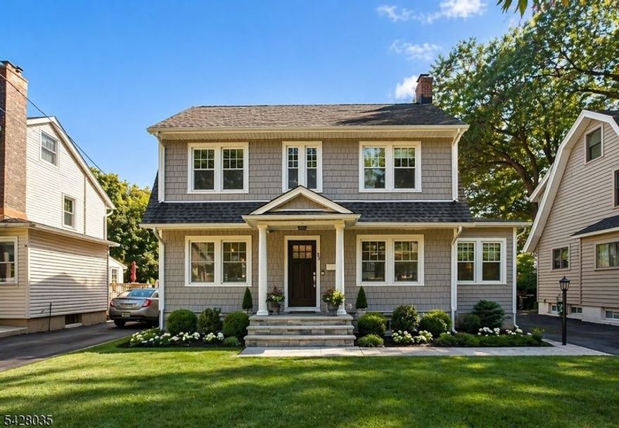 Welcome to this stunning colonial home. The attention to detail is unmistakable. A grand entry opens to a beautifully designed open layout featuring elegant crown and base molding, which adds both warmth and sophistication. The kitchen is a true standout, showcasing leathered granite countertops, a charming farmhouse sink, ample cabinetry, subway tile backsplash, stainless steel appliances, and a stylish breakfast counter with statement lighting. Rich oak floors, recessed lighting, and tasteful fixtures flow throughout the home. The main level offers a formal dining room, living room, family room with a fireplace, and a versatile den. Upstairs, you'll find generously sized bedrooms, including a spacious primary suite with a walk-in closet and private en suite bath, along with a beautifully updated main bathroom. A walk-up attic adds yet another layer of possibility, offering an exceptional bonus space that may serve beautifully as a potential fourth bedroom, private home office, creative studio, or refined retreat. The basement level continues the home's impressive versatility, featuring a rec room ideal for relaxation or entertaining, a dedicated laundry area, abundant storage, and a separate utility room, all thoughtfully incorporated to enhance both comfort and everyday functionality