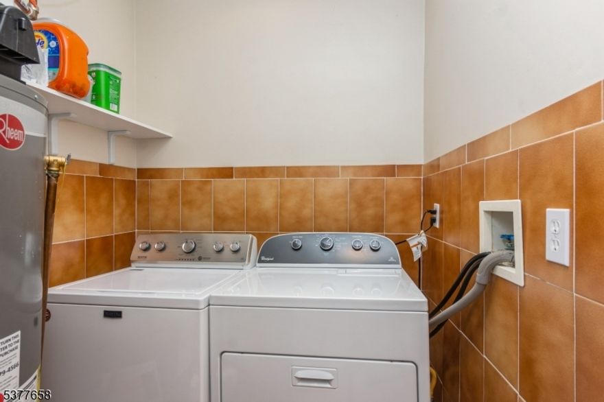 Built with unwavering care and meticulous attention to detail for its original owners, this pristine 3-bedroom, 3-bath residence is a testament to quality craftsmanship and timeless design. Set far back from the street on an expansive, private lot, the home is embraced by lush, professionally landscaped grounds that create a serene, park-like setting. Nestled on a quiet street, a charming front yard patio offers the perfect spot for morning coffee or elegant outdoor gatherings. Inside, every space radiates pride of ownership?meticulously maintained, thoughtfully designed, and truly move-in ready.The location is just as impressive: close to all three Linden schools, only three blocks from Memorial Park, one block from a neighborhood park, and just 100 feet from the school bus stop. Perfectly positioned near boutique shopping, Jersey Gardens, and acclaimed dining, this home also offers unbeatable commuter convenience with direct train or bus service from Linden to Manhattan, plus Newark Liberty International Airport just 0.8 miles away.This exceptional property combines privacy, elegance, and convenience in one rare offering!