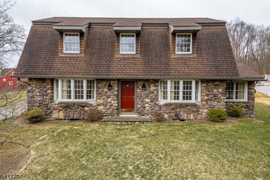 Beautiful Fieldstone Colonial overlooking the Rockaway River !! Contractors own personal house he has totally redone but made sure to keep the original charm intact, very open floor plan, fireplace in living room, hardwood floors, high ceilings, full basement could easily be finished for extra living space if needed, 2 separate master bedroom options with full baths -one upstairs and one on the main level, huge detached garage/worshop with separate entrance to loft area and bathroom. House show great inside and out !!