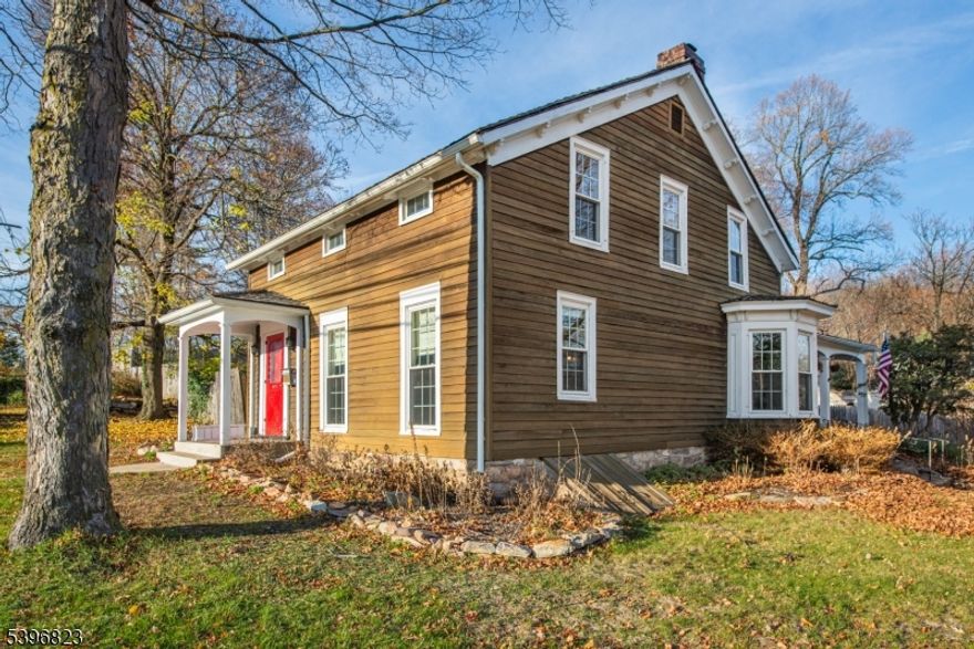 A Remarkable Blend of 18th-Century History & Modern Luxury! Discover a rare 1756 Colonial with an1830 addition. Once a well-traveled Revolutionary War tavern, this exceptional home has been meticulously restored and preserves treasured period elements including exposed hand-hewn beams, wide-plank floors, an original beehive oven, and multiple fireplaces, all seamlessly complemented by thoughtful modern updates. The formal dining room showcases an elegant bay-window alcove and fireplace, while pocket doors open to a warm, inviting living room with beautifully finished hardwood floors. The updated kitchen features quartz countertops, newer appliances, and large windows that fill the space with natural light. Modern comforts include 2-zone central air, 2-zone heating, and updated windows. Offering 4 bedrooms (2 without closets) and 3 baths, this home provides flexible spaces ideal for work, studio, or guest accommodations. Set on nearly an acre of beautifully landscaped property, the outdoor experience is fantastic as it features a multi-tier private backyard, three stone patios, Hessian-built walls, and a garden pergola, perfect for entertaining or peaceful everyday enjoyment. Prominently positioned among other historic Colonial homes in the heart of Succasunna, the location offers convenient access to shopping, dining, and major routes including 10, 46, 15, 80, and 206. A truly remarkable offering with rare historic character and modern livability! Don't miss this one!