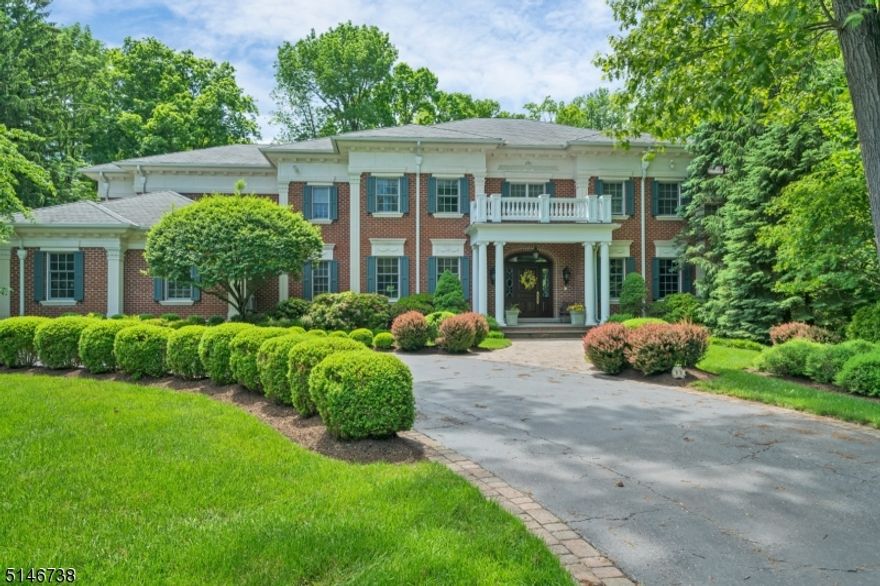 YOU MUST SEE THIS HOME!  Photos do not do it justice!  You need to feel the doors, see how high the ceilings are in person!  The grounds are exquisite!   The private 1.8 acre setting offers you a landscaped oasis. In the private backyard, enjoy a pond, patio and gazebo creating a pristine setting. As you walk through this home, you will be amazed by it's size. The oversized windows, doors and 10 foot ceilings are rich in detail and design. There are four bedrooms on the second floor and each features its own en-suite bath. Each oversized bedroom has moldings, large in size, hardwood floors and some suites feature access to their own terrace.When it's time for dinner, enjoy your gorgeous gourmet kitchen with stunning views of the backyard and direct access to the bluestone patio. The main level of this home features formal entry, dining room and living room, a spacious family room and private office both feature custom coffered ceilings and millwork. This gracious home also features a main level suite with a full bath has which has flexible use and is perfect for overnight guests. Rounding out the main level is a spacious mud room that has direct access to the oversized 3 car garage. This home is walking distance to a direct train to NYC, and is in close proximity to downtown Morristown, with posh restaurants and shops. Do not miss this home.